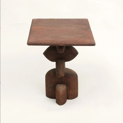 Rustic wooden end table with artistic sculptural base in boho style