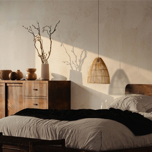 Handwoven rattan ceiling lamp over boho bedroom nightstand