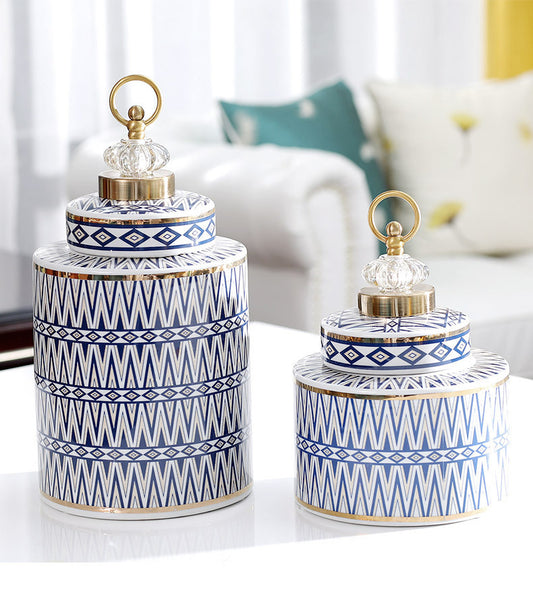 Two handmade ceramic jars with intricate lid and geometric design